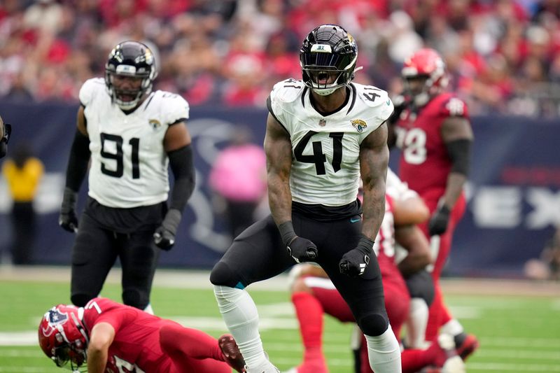 Jacksonville Jaguars linebacker Josh Allen (41) celebrates after sacking Houston Texans quarterback C.J. Stroud (7) in the second half of an NFL football game in Houston, Sunday, Nov. 26, 2023. (AP Photo/Eric Christian Smith)