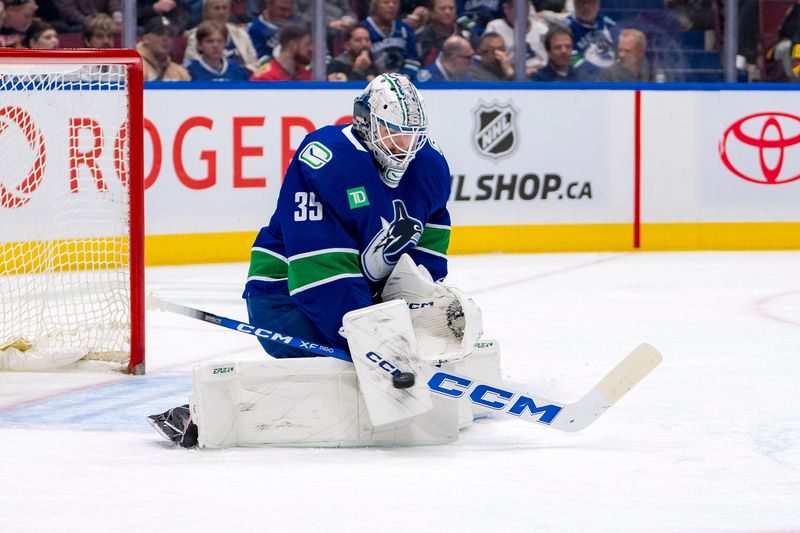 Apr 16, 2024; Vancouver, British Columbia, CAN; Vancouver Canucks goalie Thatcher Demko (35) makes a save against the Calgary Flames in the second period at Rogers Arena. Mandatory Credit: Bob Frid-USA TODAY Sports