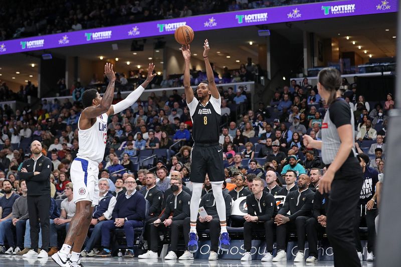 MEMPHIS, TENNESSEE - FEBRUARY 23: Ziaire Williams #8 of the Memphis Grizzlies take a shot against Paul George #13 of the LA Clippers during the second half at FedExForum on February 23, 2024 in Memphis, Tennessee. NOTE TO USER: User expressly acknowledges and agrees that, by downloading and or using this photograph, User is consenting to the terms and conditions of the Getty Images License Agreement. (Photo by Justin Ford/Getty Images)