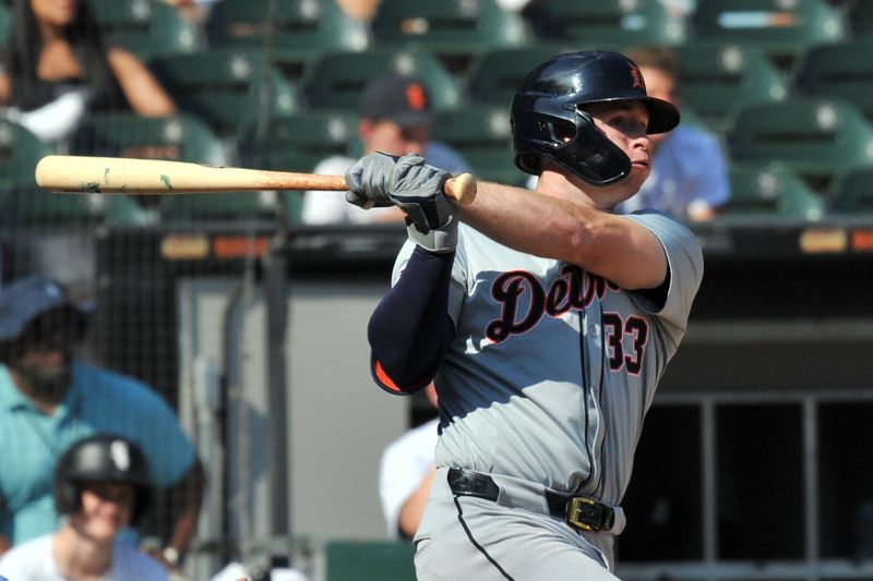 Aug 25, 2024; Chicago, Illinois, USA; Detroit Tigers second base Colt Keith (33) hits a two-run double during the eighth inning against the Chicago White Sox at Guaranteed Rate Field. Mandatory Credit: Patrick Gorski-USA TODAY Sports