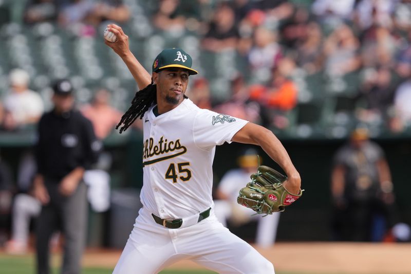 Aug 17, 2024; Oakland, California, USA; Oakland Athletics starting pitcher Osvaldo Bido (45) throws a pitch against the San Francisco Giants during the first inning at Oakland-Alameda County Coliseum. Mandatory Credit: Darren Yamashita-USA TODAY Sports