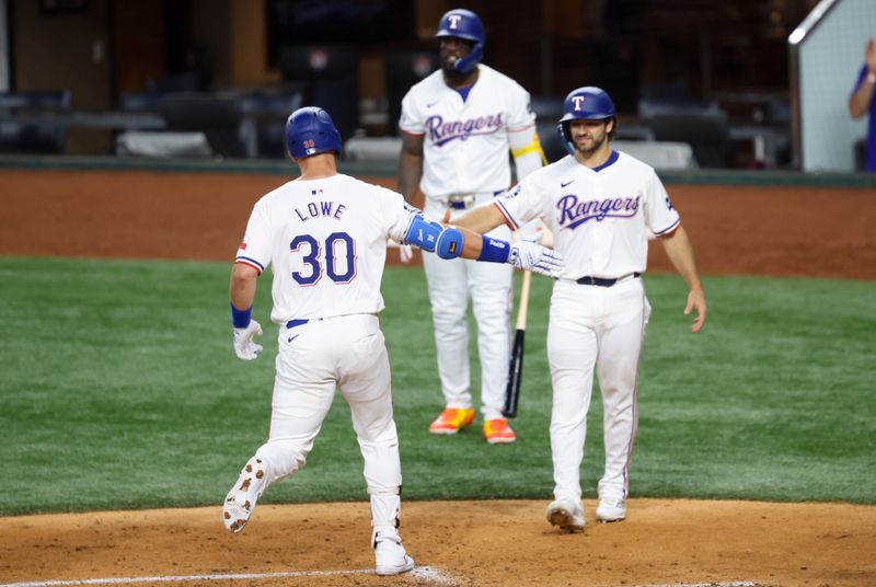 Jul 2, 2024; Arlington, Texas, USA;  Texas Rangers first baseman Nathaniel Lowe (30) celebrates with Texas Rangers shortstop Josh Smith (8) after hitting a two-run home run during the third inning against the San Diego Padres at Globe Life Field. Mandatory Credit: Kevin Jairaj-USA TODAY Sports