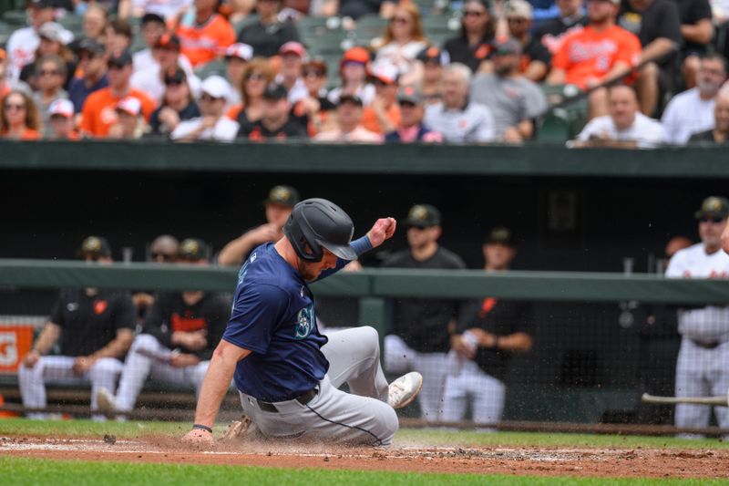 May 19, 2024; Baltimore, Maryland, USA; Seattle Mariners outfielder Luke Raley (20) scores a run during the second inning against the Baltimore Orioles at Oriole Park at Camden Yards. Mandatory Credit: Reggie Hildred-USA TODAY Sports