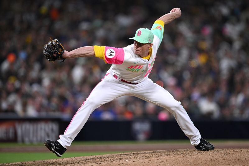 Jul 7, 2023; San Diego, California, USA; San Diego Padres relief pitcher Tim Hill (25) throws a pitch against the New York Mets during the eighth inning at Petco Park. Mandatory Credit: Orlando Ramirez-USA TODAY Sports