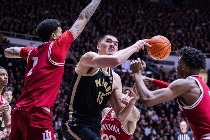 Feb 10, 2024; West Lafayette, Indiana, USA; Purdue Boilermakers center Zach Edey (15) and Indiana Hoosiers forward Anthony Walker (4) fight for the ball in the second half at Mackey Arena. Mandatory Credit: Trevor Ruszkowski-USA TODAY Sports