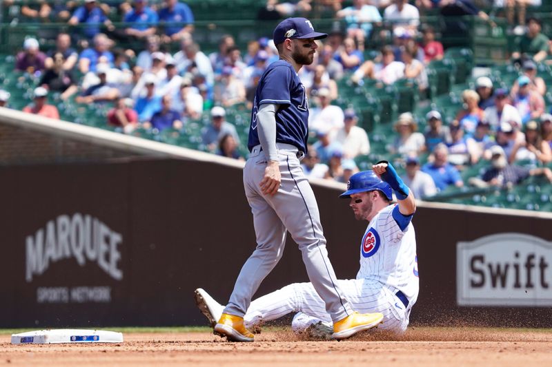 May 31, 2023; Chicago, Illinois, USA; Chicago Cubs left fielder Ian Happ (8) steals second baseas Tampa Bay Rays second baseman Brandon Lowe (8) stands nearby during the first inning at Wrigley Field. Mandatory Credit: David Banks-USA TODAY Sports