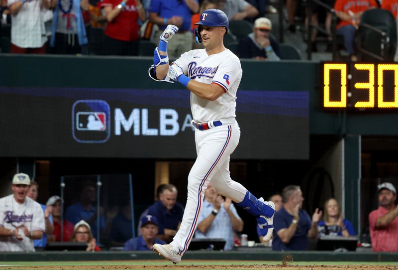 Oct 20, 2023; Arlington, Texas, USA; Texas Rangers first baseman Nathaniel Lowe (30) celebrates after hitting a solo home run during the fifth inning of game five in the ALCS against the Houston Astros for the 2023 MLB playoffs at Globe Life Field. Mandatory Credit: Kevin Jairaj-USA TODAY Sports