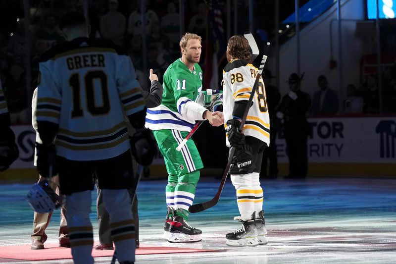 Mar 26, 2023; Raleigh, North Carolina, USA;  Carolina Hurricanes center Jordan Staal (11) and Boston Bruins right wing David Pastrnak (88) shake hands before the game at PNC Arena. Mandatory Credit: James Guillory-USA TODAY Sports