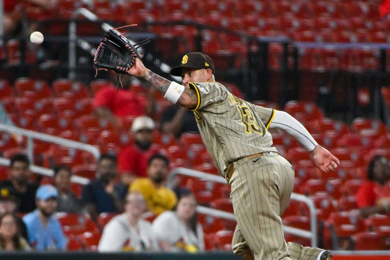 Aug 27, 2024; St. Louis, Missouri, USA;  San Diego Padres third baseman Manny Machado (13) fields a ground ball hit by St. Louis Cardinals pinch hitter Nolan Arenado (not pictured) during the ninth inning at Busch Stadium. Mandatory Credit: Jeff Curry-USA TODAY Sports