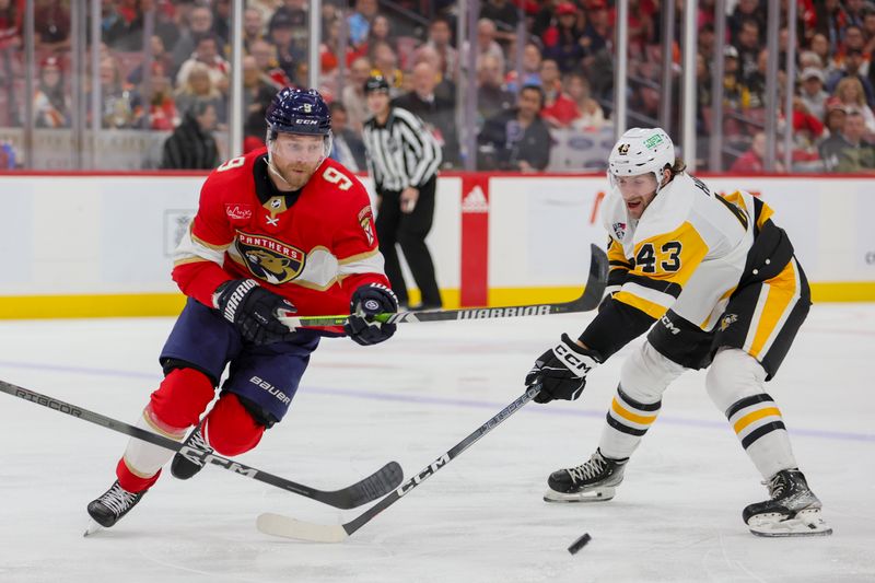 Dec 8, 2023; Sunrise, Florida, USA; Florida Panthers center Sam Bennett (9) protects the puck from Pittsburgh Penguins center Jansen Harkins (43) during the second period at Amerant Bank Arena. Mandatory Credit: Sam Navarro-USA TODAY Sports