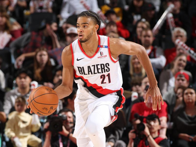 PORTLAND, OR - OCTOBER 18:  Rayan Rupert #21 of the Portland Trail Blazers dribbles the ball during the game against the Utah Jazz on October 18, 2024 at the Moda Center Arena in Portland, Oregon. NOTE TO USER: User expressly acknowledges and agrees that, by downloading and or using this photograph, user is consenting to the terms and conditions of the Getty Images License Agreement. Mandatory Copyright Notice: Copyright 2024 NBAE (Photo by Cameron Browne/NBAE via Getty Images)