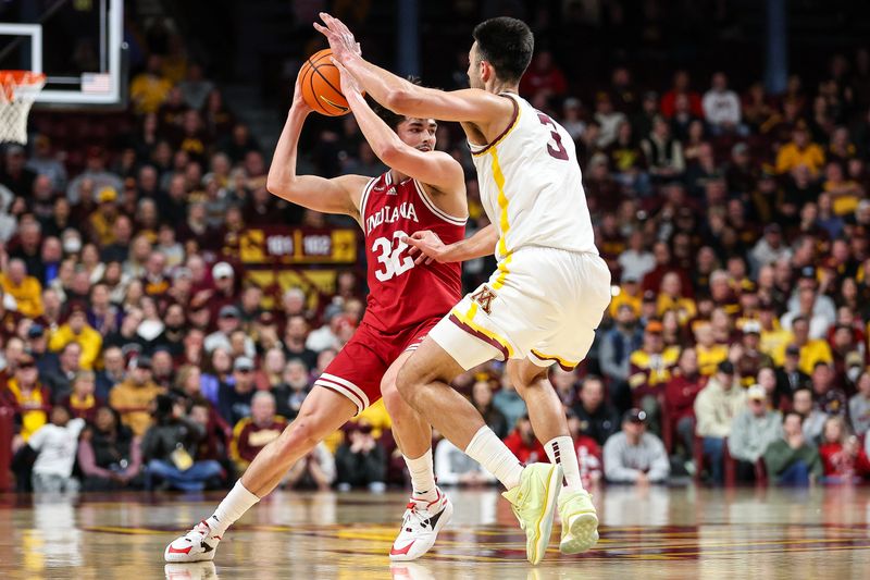 Mar 6, 2024; Minneapolis, Minnesota, USA; Indiana Hoosiers guard Trey Galloway (32) works around Minnesota Golden Gophers forward Dawson Garcia (3) during the second half at Williams Arena. Mandatory Credit: Matt Krohn-USA TODAY Sports