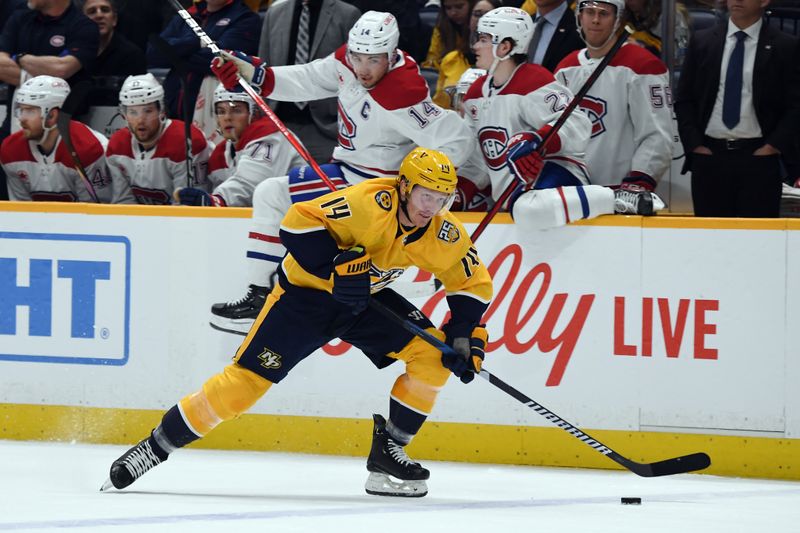 Mar 5, 2024; Nashville, Tennessee, USA; Nashville Predators center Gustav Nyquist (14) skates the puck across the blue line during the first period against the Montreal Canadiens at Bridgestone Arena. Mandatory Credit: Christopher Hanewinckel-USA TODAY Sports