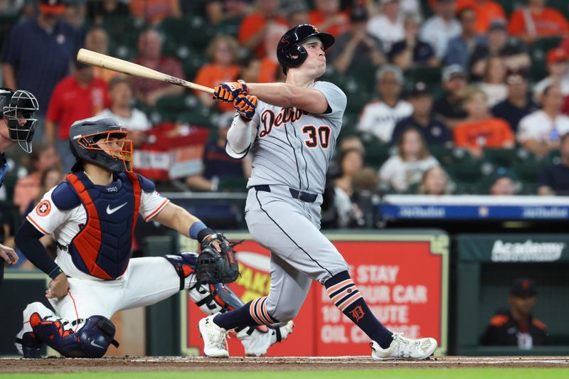 Apr 29, 2025; Houston, Texas, USA; Detroit Tigers left fielder Kerry Carpenter (30) hits a leadoff home run during the first inning against the Houston Astros at Daikin Park. Mandatory Credit: Troy Taormina-Imagn Images