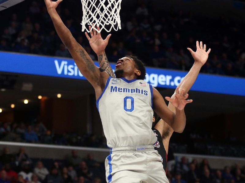 Feb 12, 2023; Memphis, Tennessee, USA; Memphis Tigers guard Elijah McCadden (0) drives to the basket during the first half against the Temple Owls at FedExForum. Mandatory Credit: Petre Thomas-USA TODAY Sports