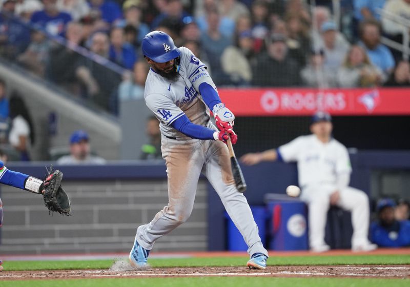 Apr 26, 2024; Toronto, Ontario, CAN; Los Angeles Dodgers left fielder Teoscar Hernandez (37) hits a single against the Toronto Blue Jays during the third inning at Rogers Centre. Mandatory Credit: Nick Turchiaro-USA TODAY Sports