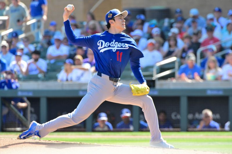 Feb 25, 2026; Salt River Pima-Maricopa, Arizona, USA; Los Angeles Dodgers pitcher Roki Sasaki (11) throws in the first inning against the Arizona Diamondbacks at Salt River Fields at Talking Stick. Mandatory Credit: Matt Kartozian-Imagn Images
