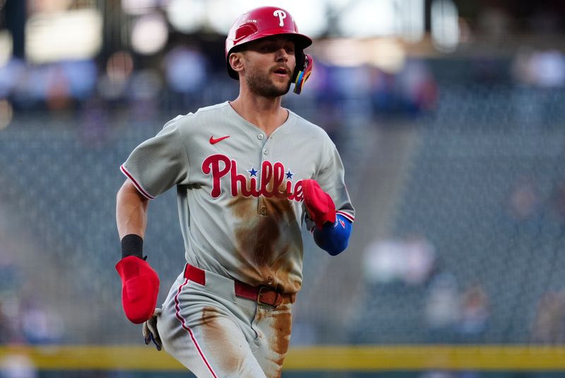 May 21, 2025; Denver, Colorado, USA; Philadelphia Phillies shortstop Trea Turner (7) scores a run in the first inning against the Colorado Rockies at Coors Field. Mandatory Credit: Ron Chenoy-Imagn Images