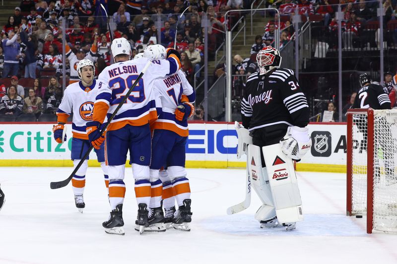 Apr 15, 2024; Newark, New Jersey, USA; New York Islanders center Kyle Palmieri (21) celebrates his goal against the New Jersey Devils during the first period at Prudential Center. Mandatory Credit: Ed Mulholland-USA TODAY Sports