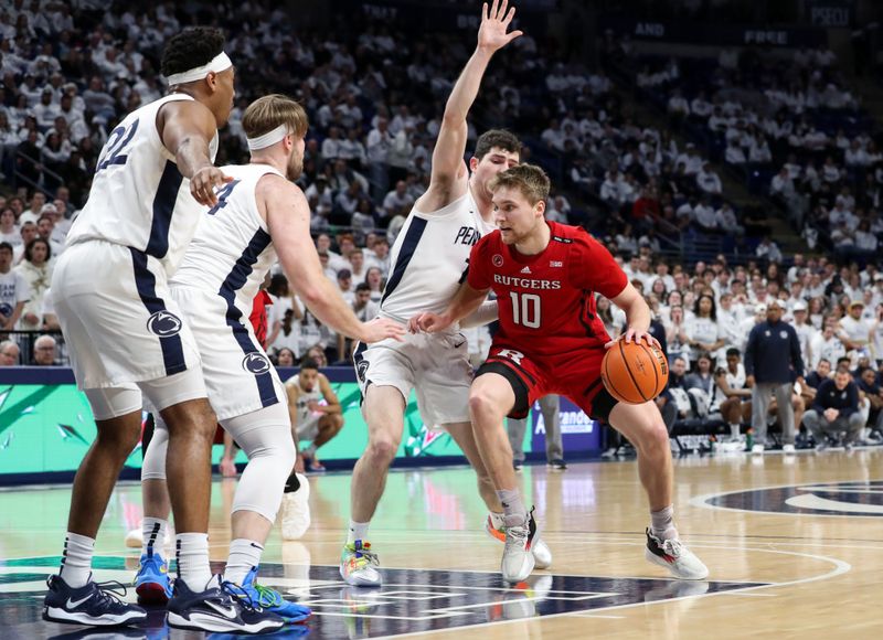 Feb 26, 2023; University Park, Pennsylvania, USA; Rutgers Scarlet Knights guard Cam Spencer (10) dribbles the ball towards the basket as Penn State Nittany Lions guard Andrew Funk (10) defends during the second half at Bryce Jordan Center. Rutgers defeated Penn State 59-56. Mandatory Credit: Matthew OHaren-USA TODAY Sports