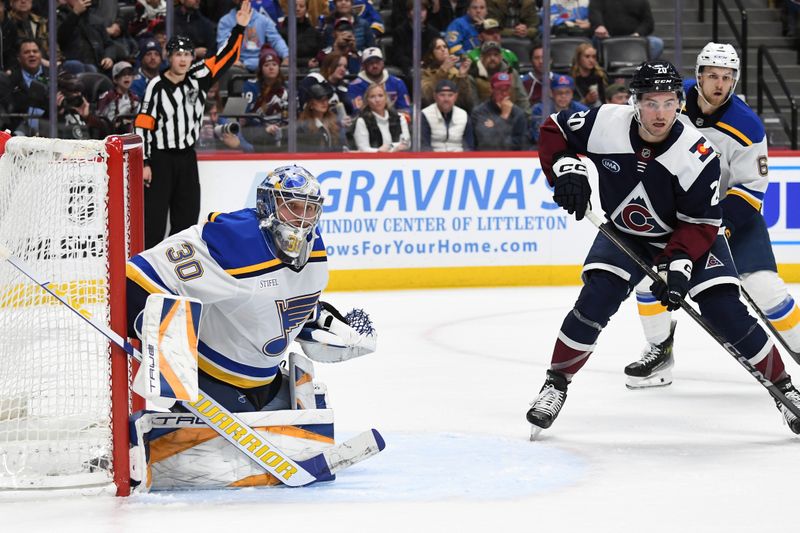 Jan 31, 2025; Denver, Colorado, USA; St. Louis Blues goaltender Joel Hofer (30) watches the puck during the second period against the Colorado Avalanche at Ball Arena. Mandatory Credit: Christopher Hanewinckel-Imagn Images