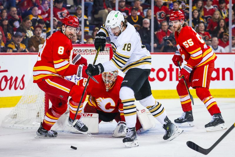 Feb 22, 2024; Calgary, Alberta, CAN; Boston Bruins center Pavel Zacha (18) and Calgary Flames defenseman Chris Tanev (8) battles for the puck in front of Calgary Flames goaltender Jacob Markstrom (25) during the third period at Scotiabank Saddledome. Mandatory Credit: Sergei Belski-USA TODAY Sports