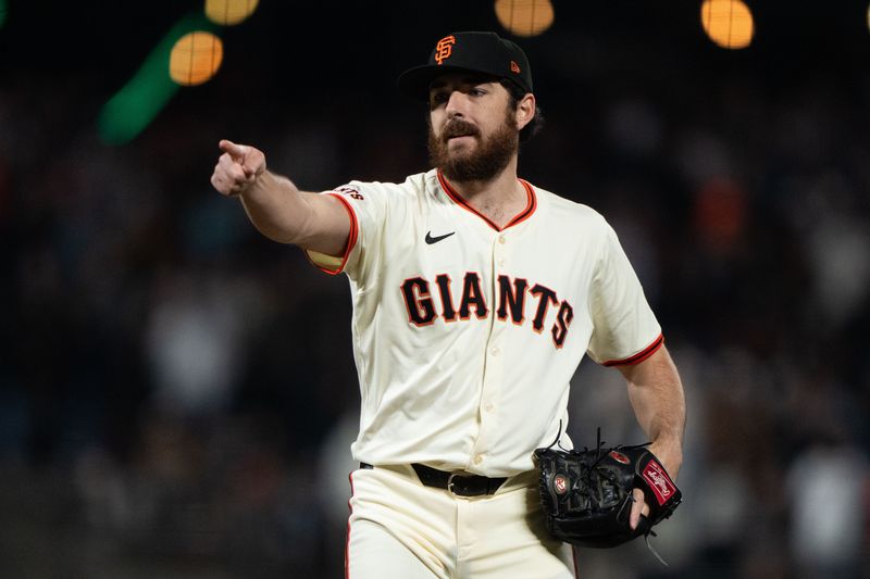 Apr 18, 2024; San Francisco, California, USA; San Francisco Giants pitcher Ryan Walker (74) reacts after defeating the Arizona Diamondbacks at Oracle Park. Mandatory Credit: Stan Szeto-USA TODAY Sports