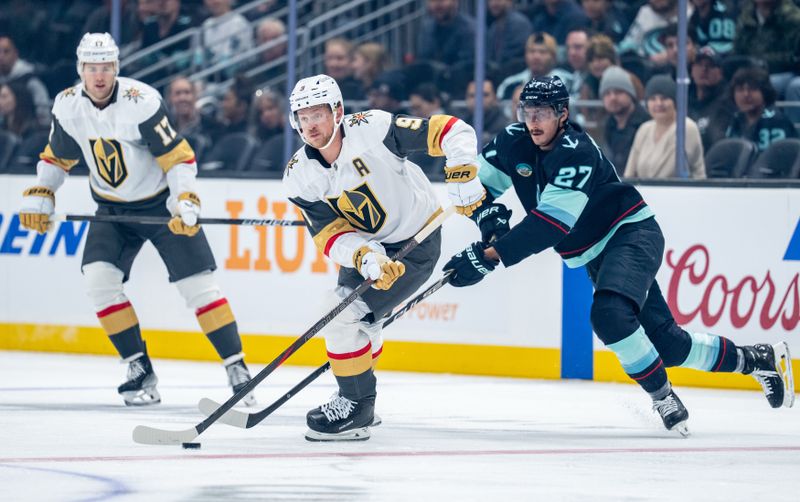 Oct 11, 2025; Seattle, Washington, USA; Vegas Golden Knights forward Jack Eichel (9) skates against Seattle Kraken forward Mason Marchment (27) during the first period at Climate Pledge Arena. Mandatory Credit: Stephen Brashear-Imagn Images