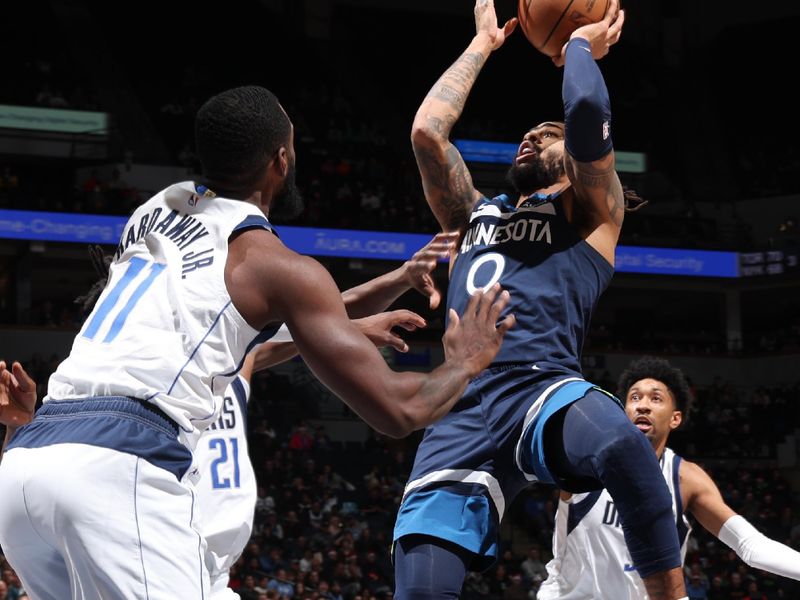 MINNEAPOLIS, MN -  DECEMBER 21: D'Angelo Russell #0 of the Minnesota Timberwolves drives to the basket during the game against the Dallas Mavericks on December 21, 2022 at Target Center in Minneapolis, Minnesota. NOTE TO USER: User expressly acknowledges and agrees that, by downloading and or using this Photograph, user is consenting to the terms and conditions of the Getty Images License Agreement. Mandatory Copyright Notice: Copyright 2022 NBAE (Photo by David Sherman/NBAE via Getty Images)