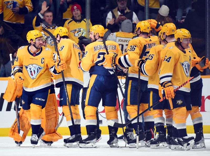 Nov 12, 2022; Nashville, Tennessee, USA; Nashville Predators players celebrate after a win against the New York Rangers at Bridgestone Arena. Mandatory Credit: Christopher Hanewinckel-USA TODAY Sports