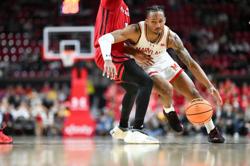 Feb 6, 2024; College Park, Maryland, USA; Maryland Terrapins guard Jahmir Young (1) dribbles past Rutgers Scarlet Knights guard Jamichael Davis (1) during the second half  at Xfinity Center. Mandatory Credit: Tommy Gilligan-USA TODAY Sports