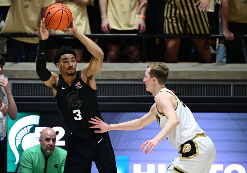 Mar 2, 2024; West Lafayette, Indiana, USA; Michigan State Spartans guard Jaden Akins (3) passes the ball away from Purdue Boilermakers guard Fletcher Loyer (2) during the second half at Mackey Arena. Mandatory Credit: Marc Lebryk-USA TODAY Sports