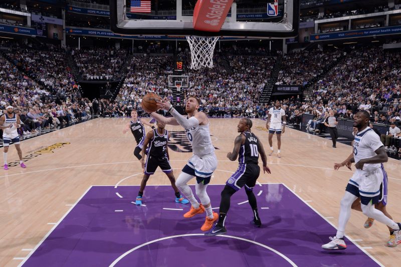 SACRAMENTO, CA - OCTOBER 24: Donte DiVincenzo #0 of the Minnesota Timberwolves drives to the basket during the game against the Sacramento Kings on October 24, 2024 at Golden 1 Center in Sacramento, California. NOTE TO USER: User expressly acknowledges and agrees that, by downloading and or using this Photograph, user is consenting to the terms and conditions of the Getty Images License Agreement. Mandatory Copyright Notice: Copyright 2024 NBAE (Photo by Rocky Widner/NBAE via Getty Images)