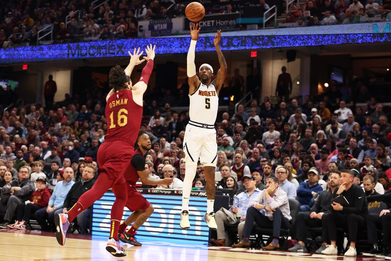 CLEVELAND, OH - FEBRUARY 23: Kentavious Caldwell-Pope #5 of the Denver Nuggets shoots a three point basket during the game against the Cleveland Cavaliers on February 23, 2023 at Rocket Mortgage FieldHouse in Cleveland, Ohio. NOTE TO USER: User expressly acknowledges and agrees that, by downloading and/or using this Photograph, user is consenting to the terms and conditions of the Getty Images License Agreement. Mandatory Copyright Notice: Copyright 2022 NBAE (Photo by  Lauren Bacho/NBAE via Getty Images)