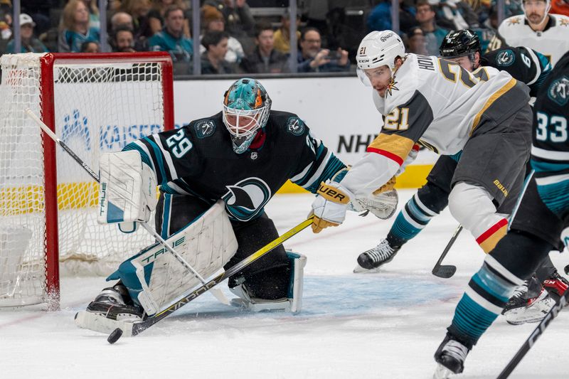 Feb 19, 2024; San Jose, California, USA; Vegas Golden Knights center Brett Howden (21) attempts to control the rebound save from San Jose Sharks goalie Mackenzie Blackwood (29) during the first period at SAP Center at San Jose. Mandatory Credit: Neville E. Guard-USA TODAY Sports