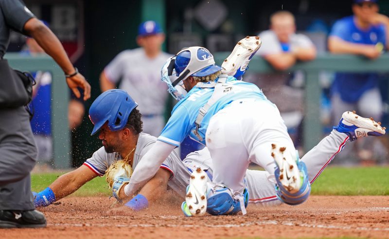 Apr 19, 2023; Kansas City, Missouri, USA; Texas Rangers third baseman Ezequiel Duran (20) is tagged out at home by Kansas City Royals catcher MJ Melendez (1) during the seventh inning at Kauffman Stadium. Mandatory Credit: Jay Biggerstaff-USA TODAY Sports