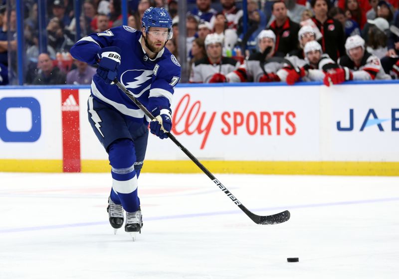 Jan 27, 2024; Tampa, Florida, USA; Tampa Bay Lightning defenseman Victor Hedman (77) passes the puck against the New Jersey Devils during the third period at Amalie Arena. Mandatory Credit: Kim Klement Neitzel-USA TODAY Sports