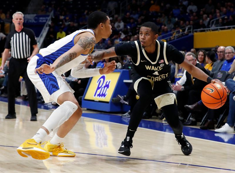 Jan 25, 2023; Pittsburgh, Pennsylvania, USA;  Wake Forest Demon Deacons guard Daivien Williamson (4) dribbles as Pittsburgh Panthers guard Greg Elliott (left) defends during the first half at the Petersen Events Center. Mandatory Credit: Charles LeClaire-USA TODAY Sports