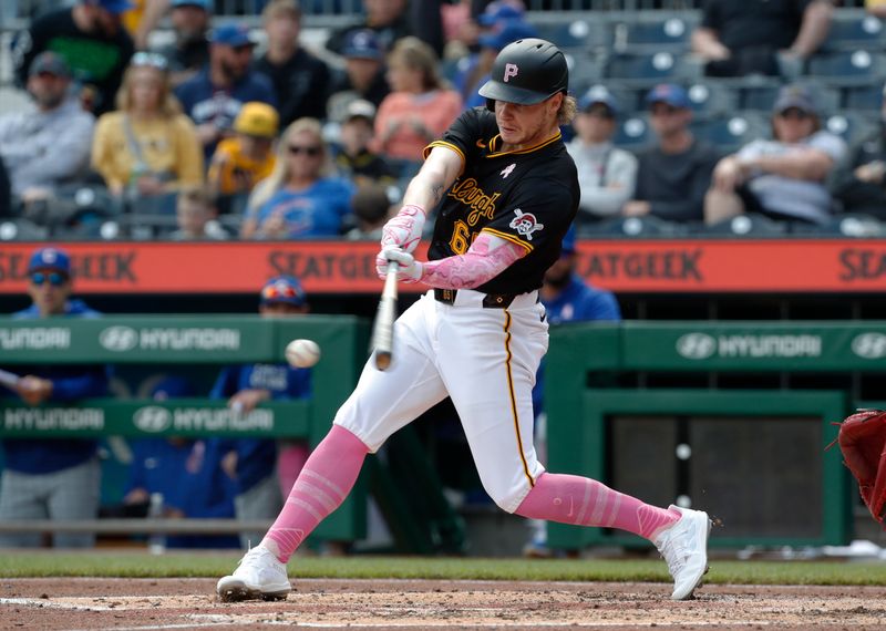 May 12, 2024; Pittsburgh, Pennsylvania, USA;  Pittsburgh Pirates center fielder Jack Suwinski (65) hits a single against the Chicago Cubs during the fourth inning at PNC Park. Mandatory Credit: Charles LeClaire-USA TODAY Sports