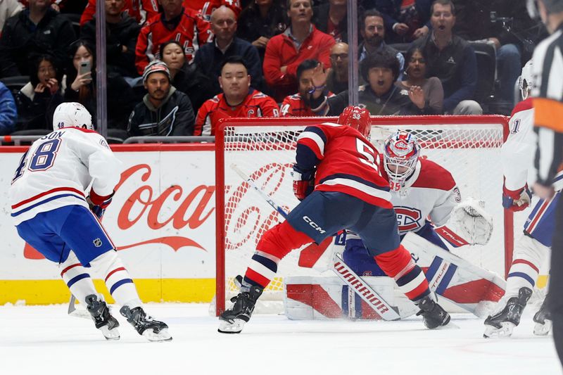 Jan 13, 2026; Washington, District of Columbia, USA; Montréal Canadiens goaltender Samuel Montembeault (35) makes a save on Washington Capitals center Ethen Frank (53) in overtime at Capital One Arena. Mandatory Credit: Geoff Burke-Imagn Images
