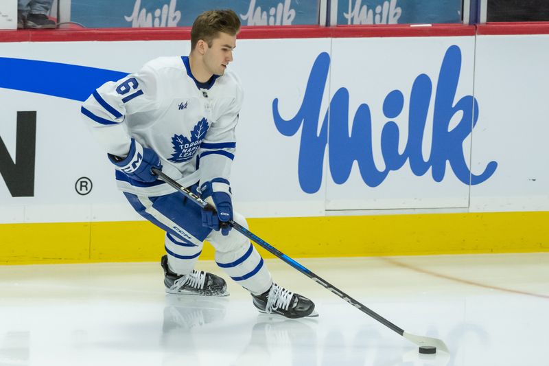 Jan 25, 2025; Ottawa, Ontario, CAN; Toronto Maple Leafs center Jacob Quillan (61) skates on his own during warmup prior to his first NHL game to be played against Ottawa Senators  at the Canadian Tire Centre. Mandatory Credit: Marc DesRosiers-Imagn Images