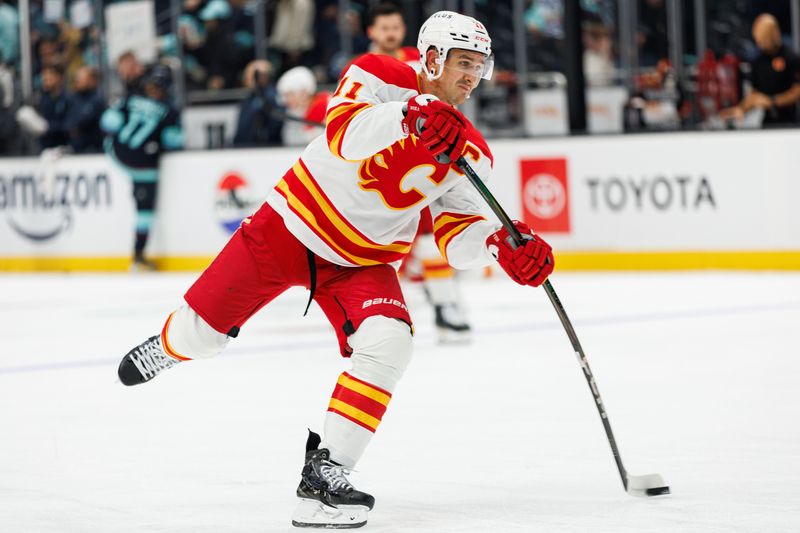 Oct 19, 2024; Seattle, Washington, USA; Calgary Flames center Mikael Backlund (11) warms up before the game against the Seattle Kraken at Climate Pledge Arena. Mandatory Credit: Caean Couto-Imagn Images