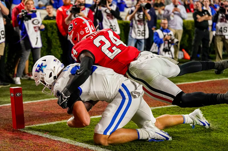 Oct 7, 2023; Athens, Georgia, USA; Kentucky Wildcats tight end Josh Kattus (84) catches a touchdown pass against Georgia Bulldogs defensive back Malaki Starks (24) during the first half at Sanford Stadium. Mandatory Credit: Dale Zanine-USA TODAY Sports