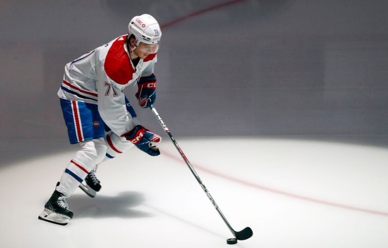 Feb 22, 2024; Pittsburgh, Pennsylvania, USA;  Montreal Canadiens center Jake Evans (71) takes the ice to warm up before the game against the Pittsburgh Penguins at PPG Paints Arena. Mandatory Credit: Charles LeClaire-USA TODAY Sports