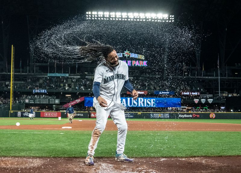 Sep 28, 2023; Seattle, Washington, USA; Seattle Mariners shortstop J.P. Crawford (3) celebrates after getting bucket of water dumped on him after game against the Texas Rangers at T-Mobile Park. Mandatory Credit: Stephen Brashear-USA TODAY Sports