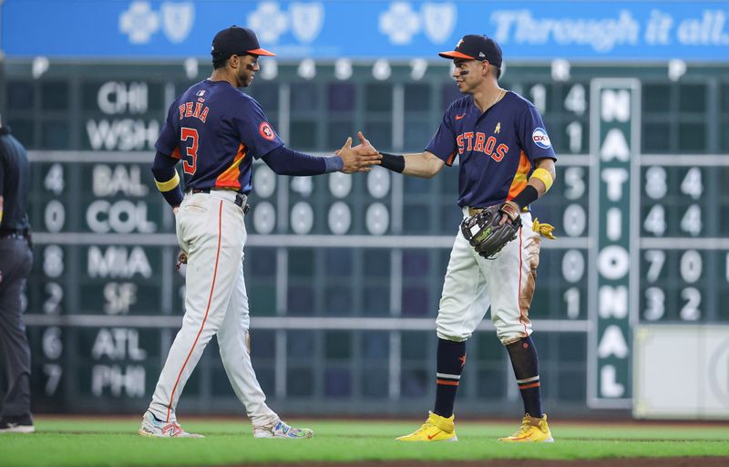 Sep 1, 2024; Houston, Texas, USA; Houston Astros shortstop Jeremy Pena (3) and second baseman Mauricio Dubon (14) celebrate after the game against the Kansas City Royals at Minute Maid Park. Mandatory Credit: Troy Taormina-USA TODAY Sports