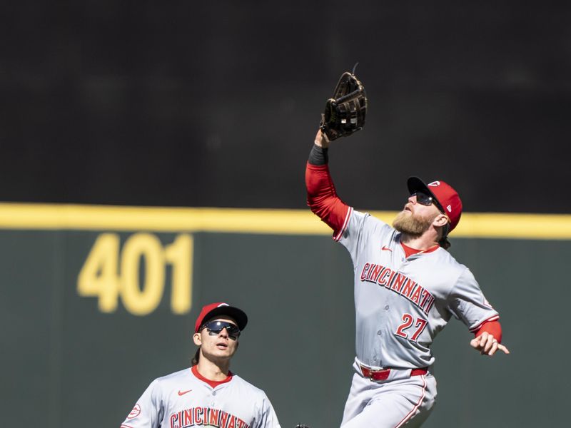 Apr 17, 2024; Seattle, Washington, USA; Right fielder Jake Fraley (27) fields a fly ball while avoiding a collision with centerfielder Stuart Fairchild (17) during the seventh inning against the Seattle Mariners at T-Mobile Park. Mandatory Credit: Stephen Brashear-USA TODAY Sports