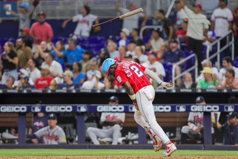 Sep 16, 2023; Miami, Florida, USA; Miami Marlins center fielder Jazz Chisholm Jr. (2) hits a grand slam against the Atlanta Braves during the eighth inning at loanDepot Park. Mandatory Credit: Sam Navarro-USA TODAY Sports