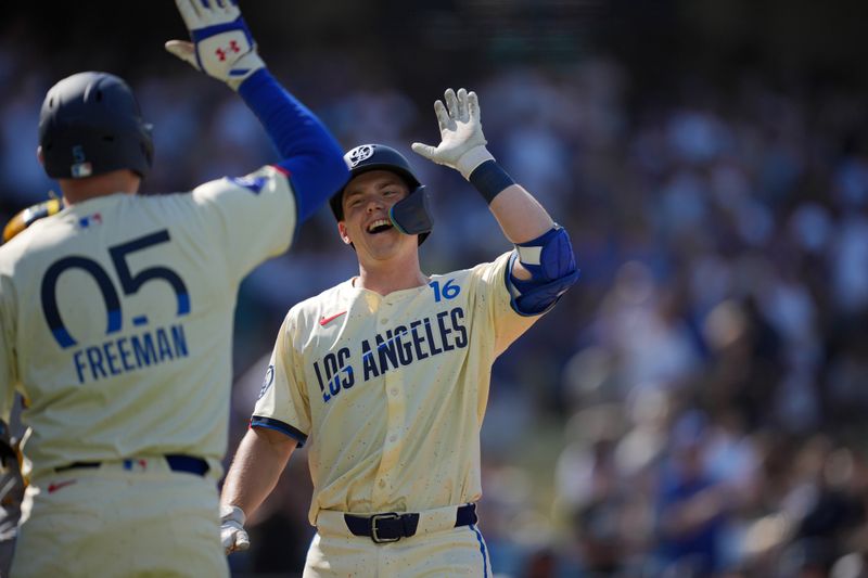 Jul 6, 2024; Los Angeles, California, USA; Los Angeles Dodgers catcher Will Smith (16) celebrates with first baseman Freddie Freeman (5) after hitting a two-run home run in the first inning against the Milwaukee Brewers at Dodger Stadium. Mandatory Credit: Kirby Lee-USA TODAY Sports