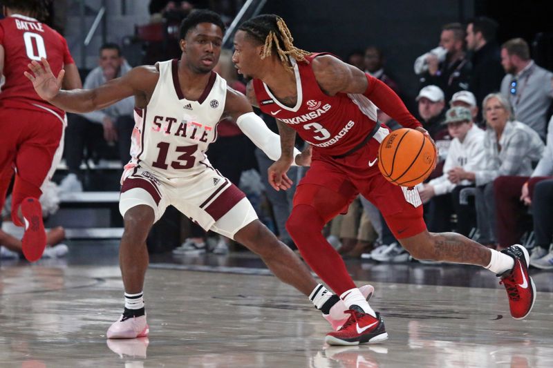 Feb 17, 2024; Starkville, Mississippi, USA; Arkansas Razorbacks guard El Ellis (3) dribbles the ball against Mississippi State Bulldogs guard Josh Hubbard (13) during the first half at Humphrey Coliseum. Mandatory Credit: Petre Thomagainst-USA TODAY Sports